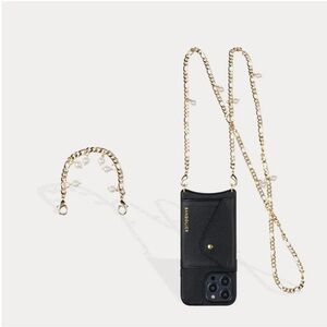 BANDOLIER ESTELLE PEARL SET
Crossbody Phone Case in Black/Gold IPHONE 14